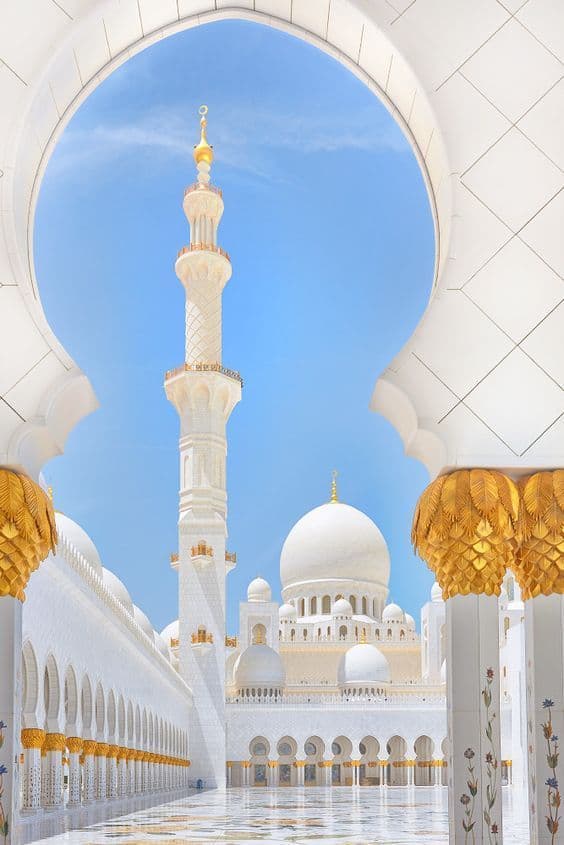 White marble arches and a minaret at Sheikh Zayed Grand Mosque